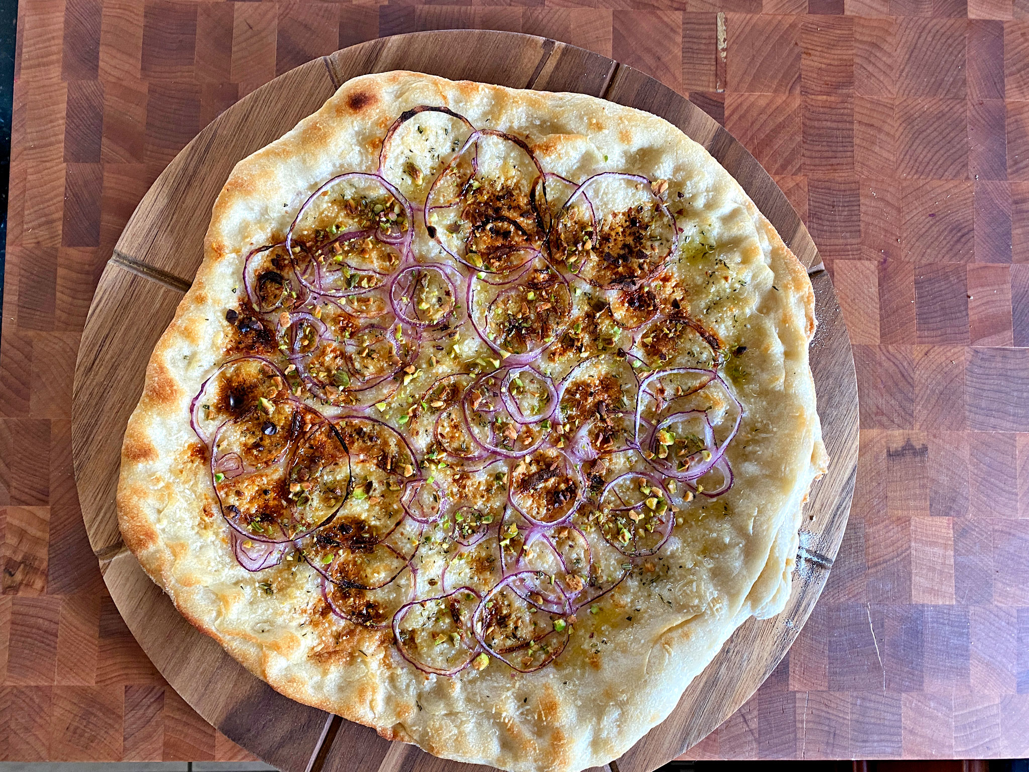 Chris Bianco's Pizza Rosa - Parmigiano-Reggiano, red onion, rosemary, pistachios, extra-virgin olive oil